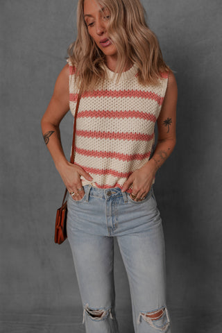 women modeling a cream and blush stripe sleeveless sweater style top
