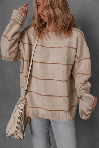 women modeling a chunky cream and brown stripe sweater