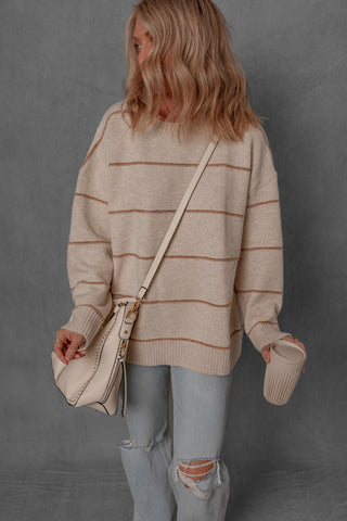 women modeling a chunky cream and brown stripe sweater