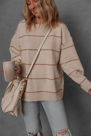 women modeling a chunky cream and brown stripe sweater