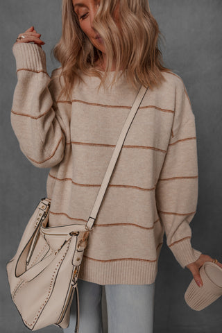 women modeling a chunky cream and brown stripe sweater