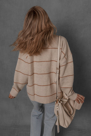 women modeling a chunky cream and brown stripe sweater